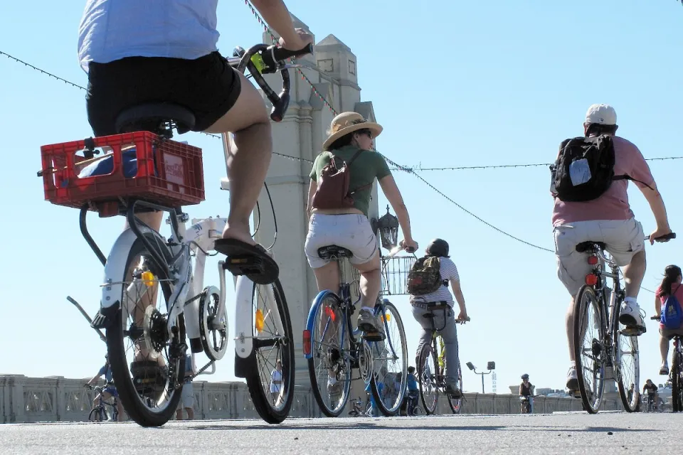 People on bikes riding across 4th Street Bridge in Los Angeles during 2010 CicLAvia event.